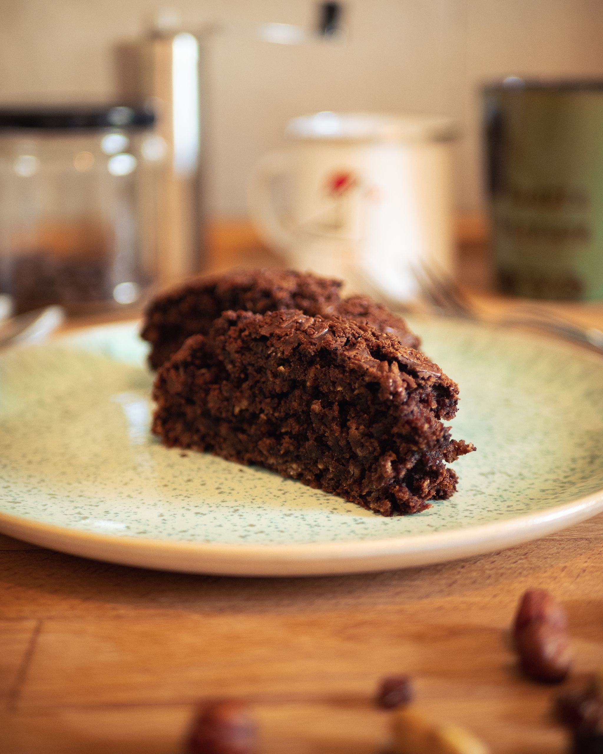Close-up of a chocolate brownie slice on a rustic plate, ideal for dessert lovers.